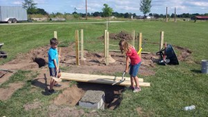Community volunteers lay the groundwork for the natural children’s playground at Waupaca’s Eco-Park in early August. The completed playground will be among several park amenities on display at Eco-Park’s dedication ceremony Saturday, Sept. 10.