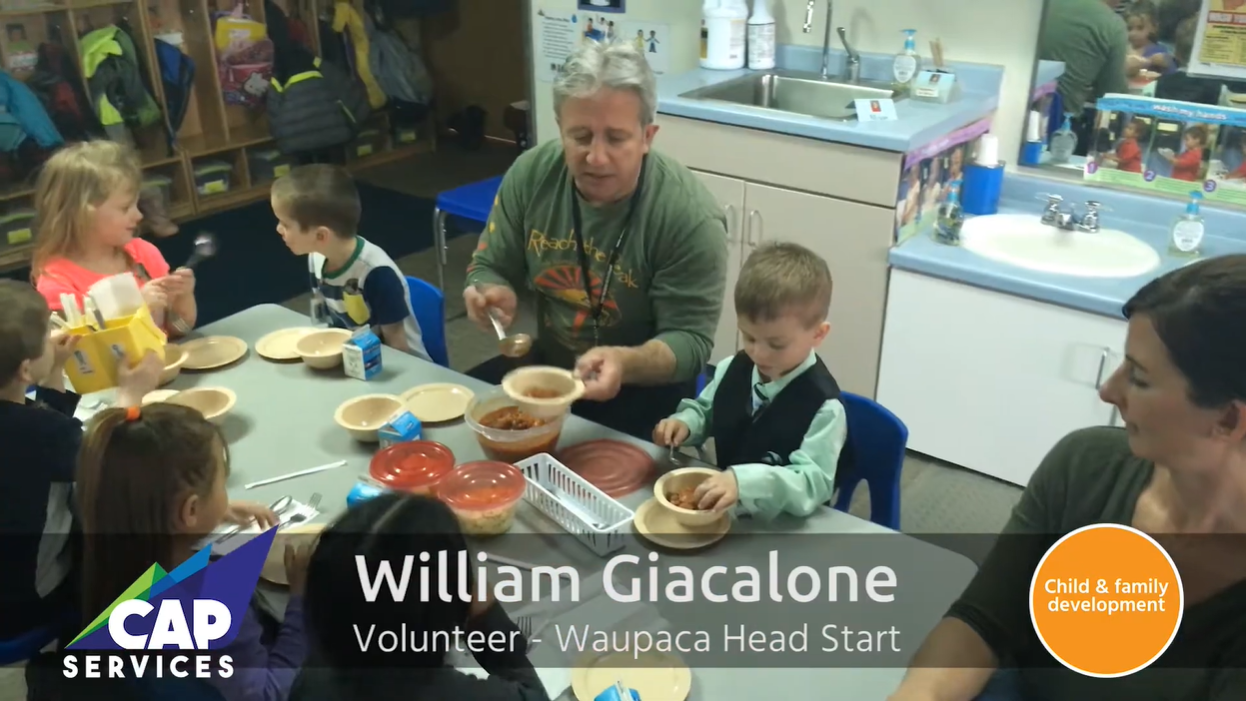 William Giacalone at head start site eating meal with the children